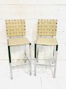 Two cream leather and chrome bar chairs