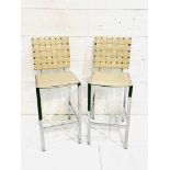 Two cream leather and chrome bar chairs