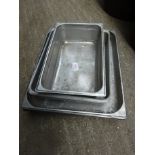 Six stainless steel serving trays