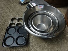 Four mixing bowls and two cake tins