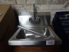 Stainless steel hand sink with tap.