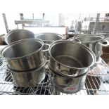 Ten stainless steel pots