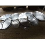 Eleven stainless steel serving trays