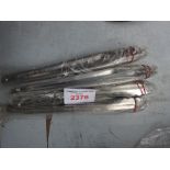 Four stainless steel tongs