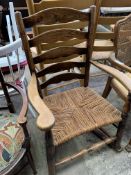 Oak framed string seat rocking armchair