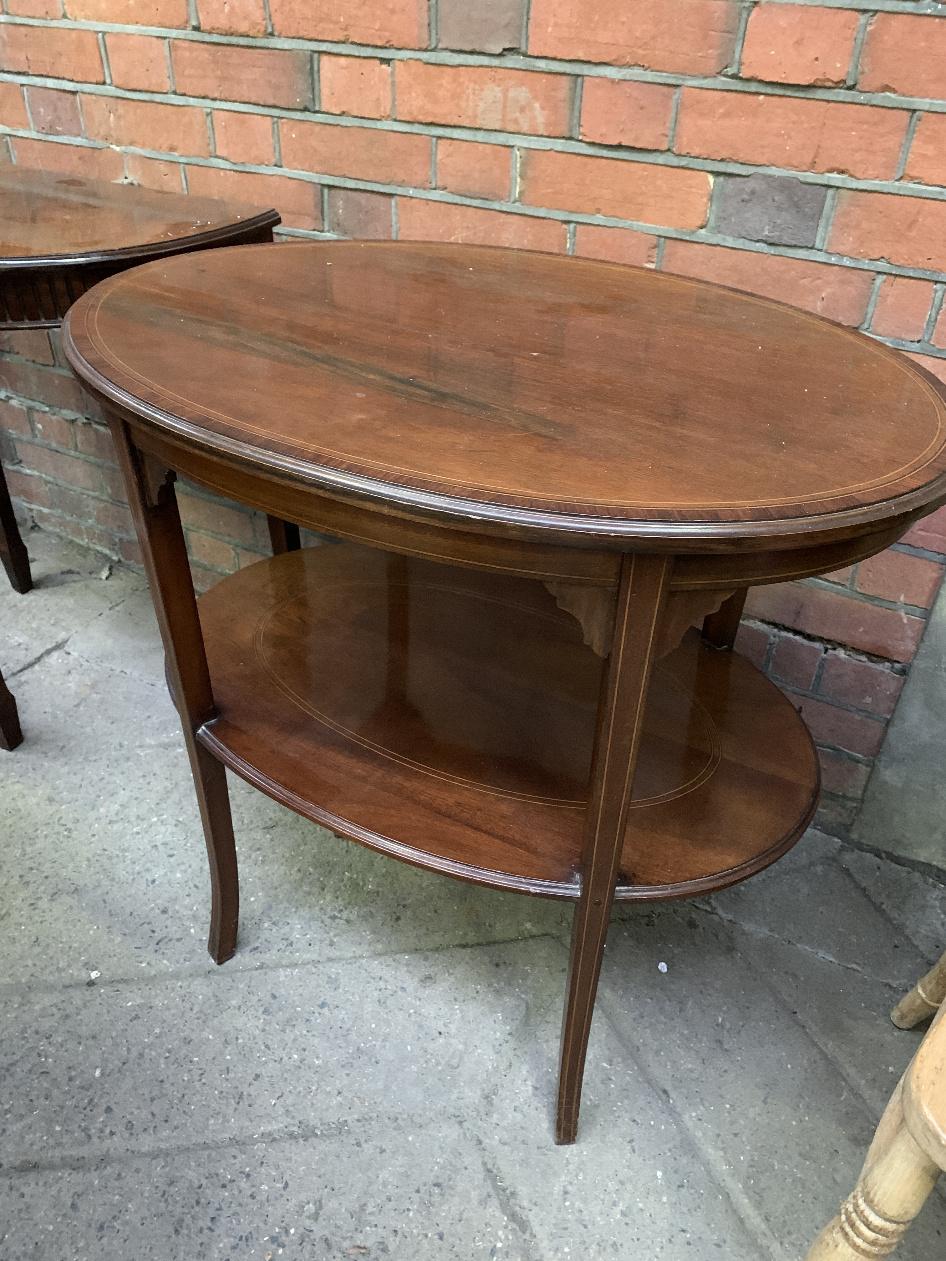 Banded inlaid mahogany oval display table together with small mahogany demi-lune table