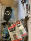 PSP mobile kit; 4 game boy carrying cases; 6 PSP games; 2 PSP memory sticks; PSP 1000.