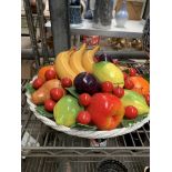 Ceramic bowl of fruit and other items