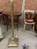 Columned brass lamp standard on square base to claw feet