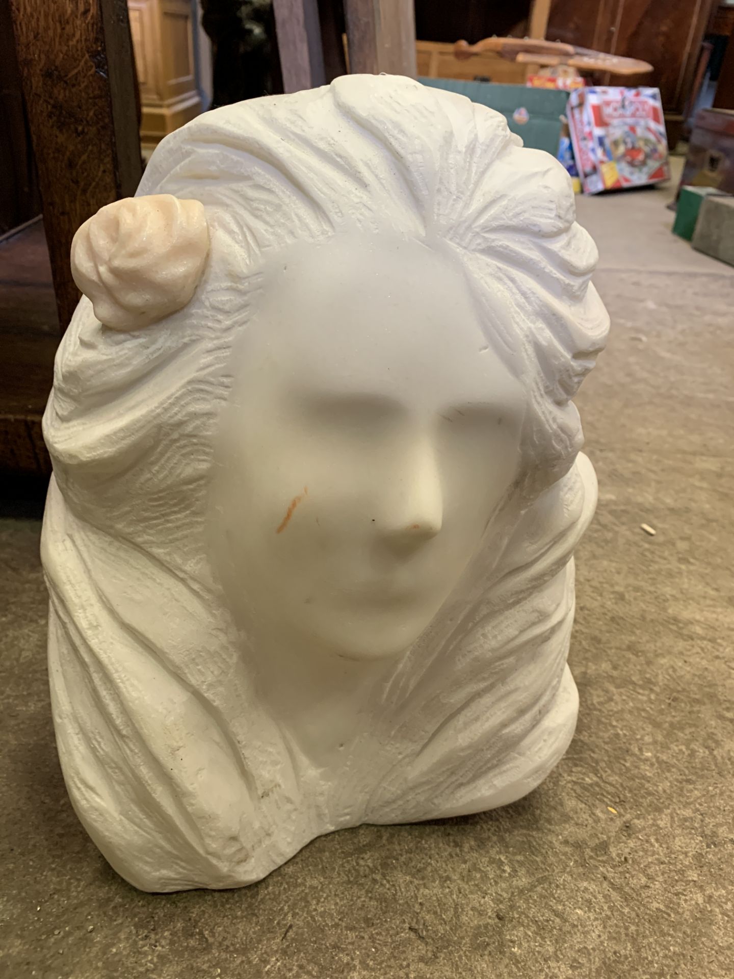 Stone sculpture of a woman's head by Fiona Goldbacher