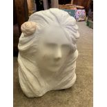 Stone sculpture of a woman's head by Fiona Goldbacher