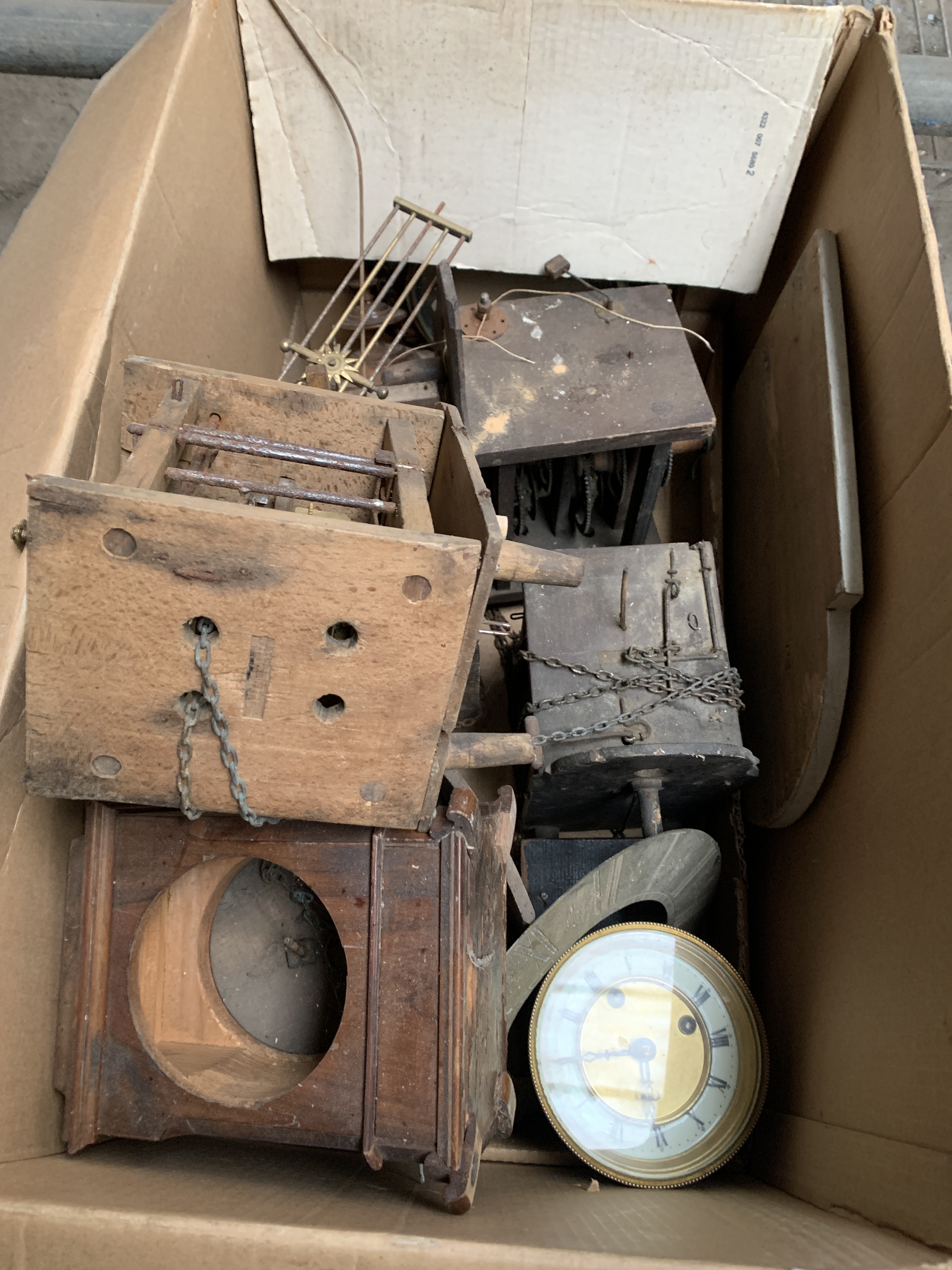 Box of various clock mechanisms and cases