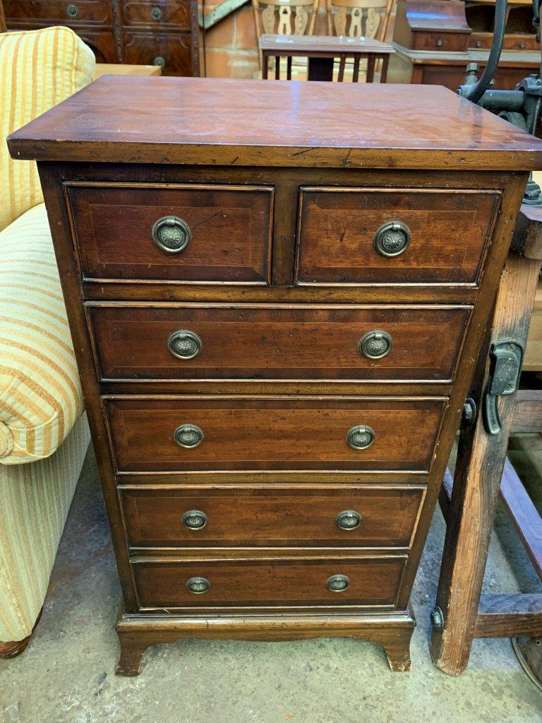 A small mahogany chest of two over four graduated drawers