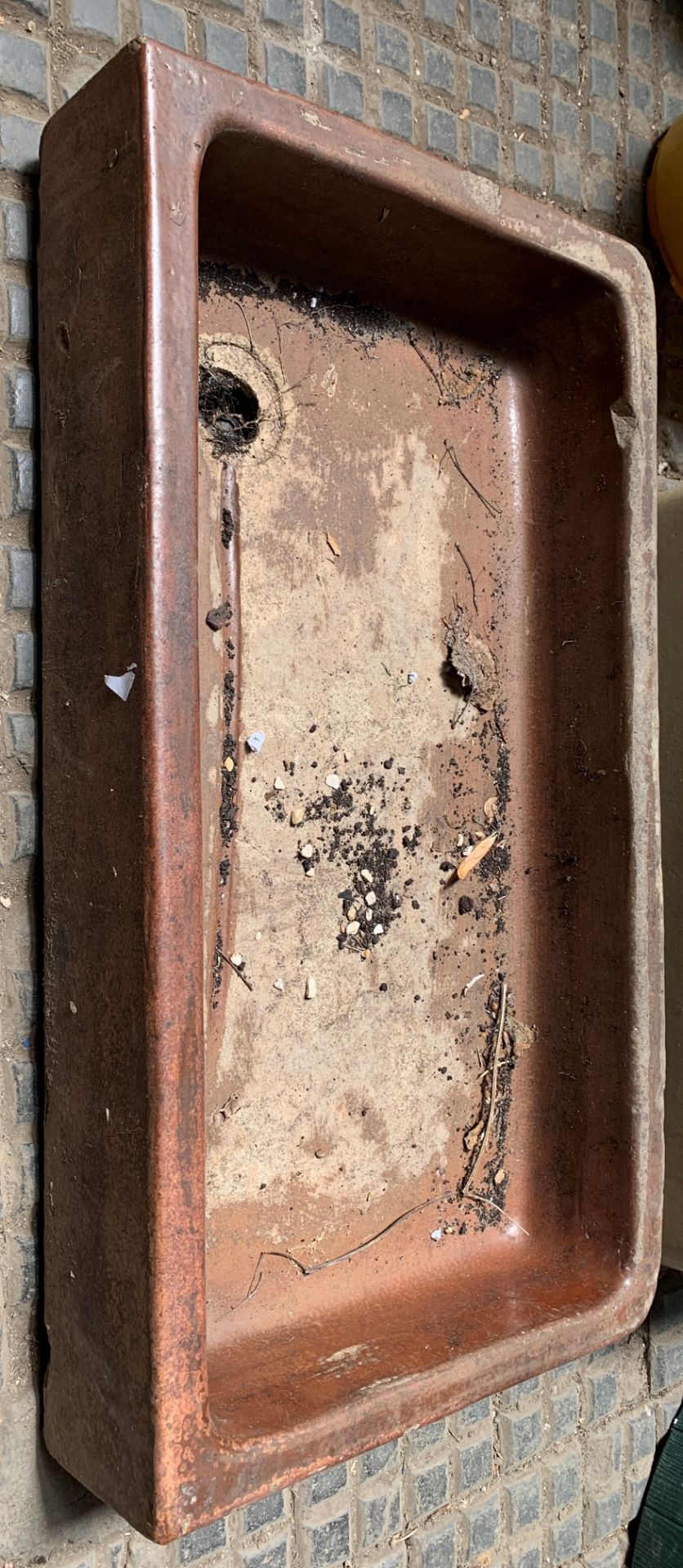 A brown stoneware sink