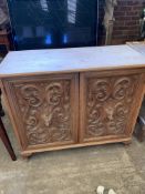 Pine sideboard with two heavily carved oak doors