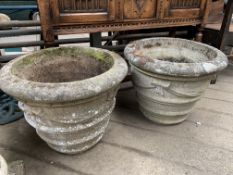 A pair of concrete planters