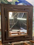 Heavily decorative framed wall mirror