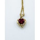 9ct gold red stone and diamond pendant on a 9ct gold chain