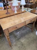 A pine side table with two frieze drawers