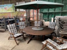 Wooden garden table, stone lazy Susan, parasol, and six reclining chairs complete with cushions