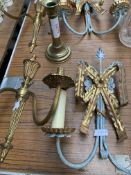 A pair of brass two branch wall sconces, a pair of decorative wall sconces, and a brass candlestick