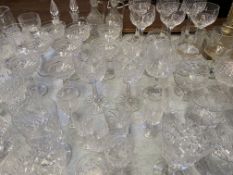 A large quantity of cut glass drinking glasses