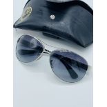 Pair of Ray Ban sunglasses in leather effect Ray Ban case