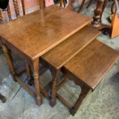 A nest of three oak tables