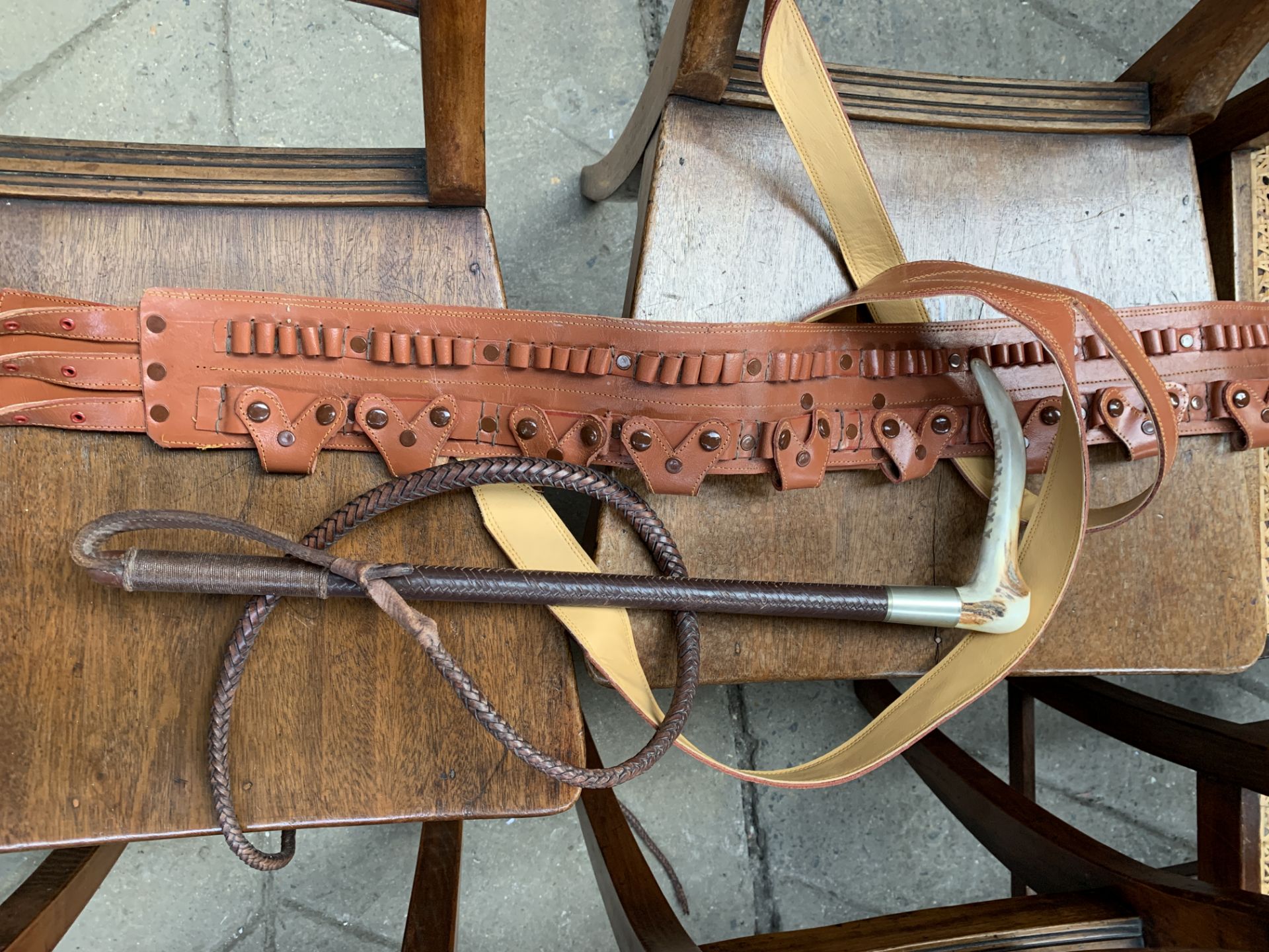 Leather bandolier and a gentleman's leather hunting whip