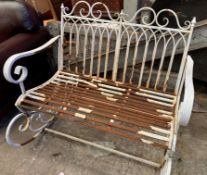 White painted wrought iron rocking garden bench