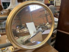 Gilt framed oval wall mirror and an oak framed bevelled edge wall mirror