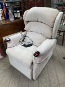 Pale beige upholstered electric reclining chair, in working order