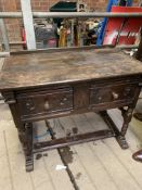 An oak side table and a matching mirror