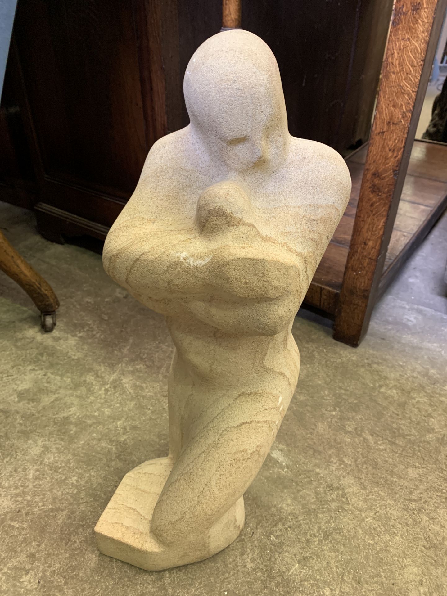 Stone sculpture of a mother and child by Fiona Goldbacher
