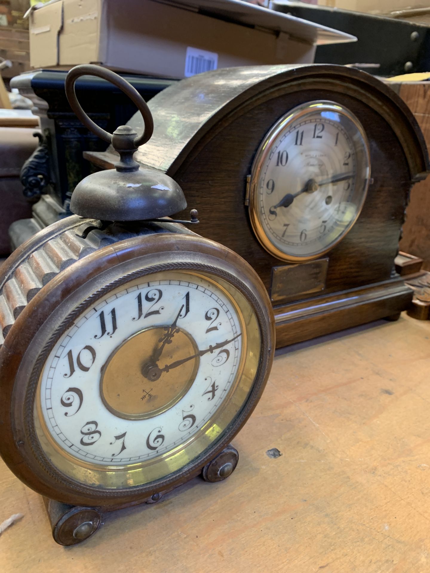 Four various mantel clocks; together with a mahogany cased early alarm clock and a banjo barometer