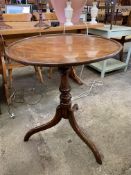 A mahogany tilt-top wine table