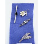 Two silver brooches and three other various brooches