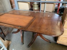 Mahogany twin pedestal extendable dining table with one leaf