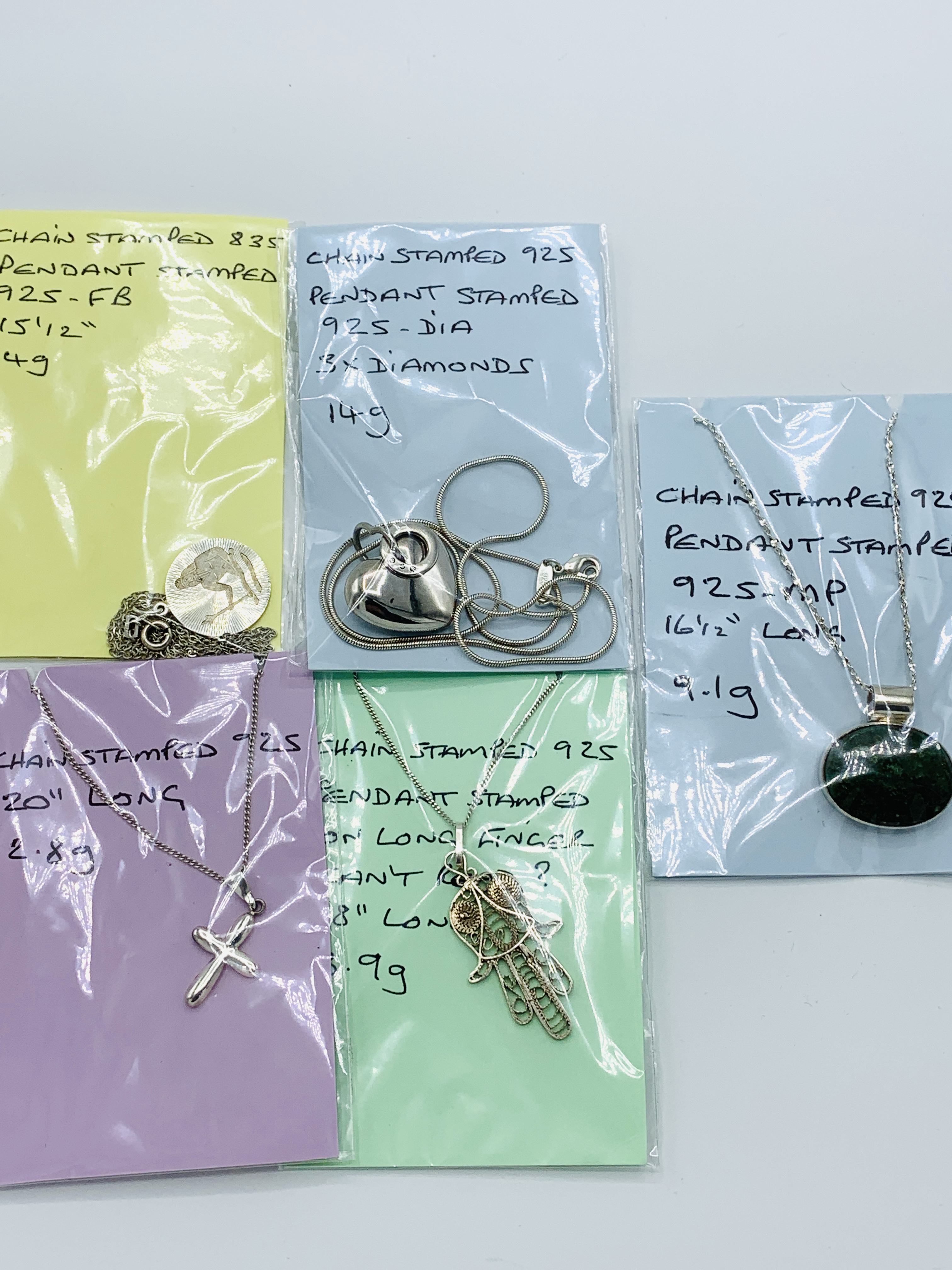 Five various 925 silver pendants and chains