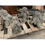 Four concrete garden ornaments