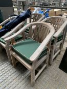 Four teak garden armchairs