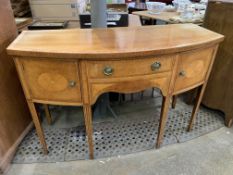 An Edwardian inlaid mahogany bow fronted sideboard