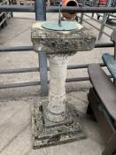 Moulded stone decorated plynth with metal sundial top