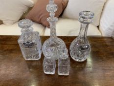 Three cut glass decanters and 2 vinegar bottles