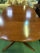 Mahogany shaped end extendable dining table together with two carvers and six chairs.