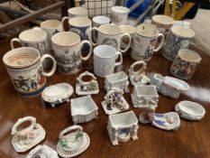 Collection of commemorative mugs and fairings