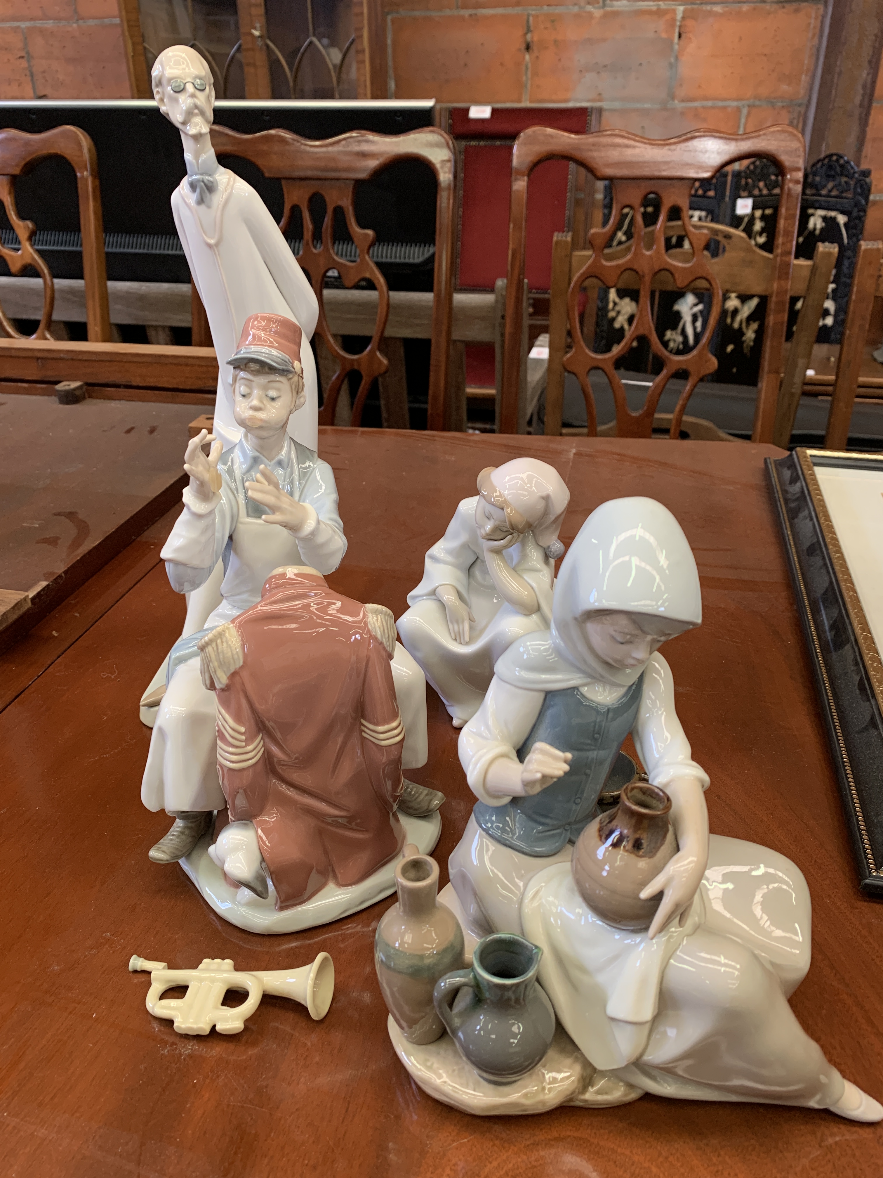 A group of four Lladro figurines