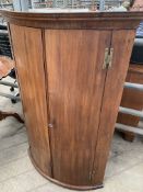 Early 19th century mahogany bow fronted wall cabinet