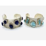 Two white metal bangles set with turquoise gemstones and purple gemstones