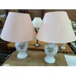 A pair of white ceramic table lamps